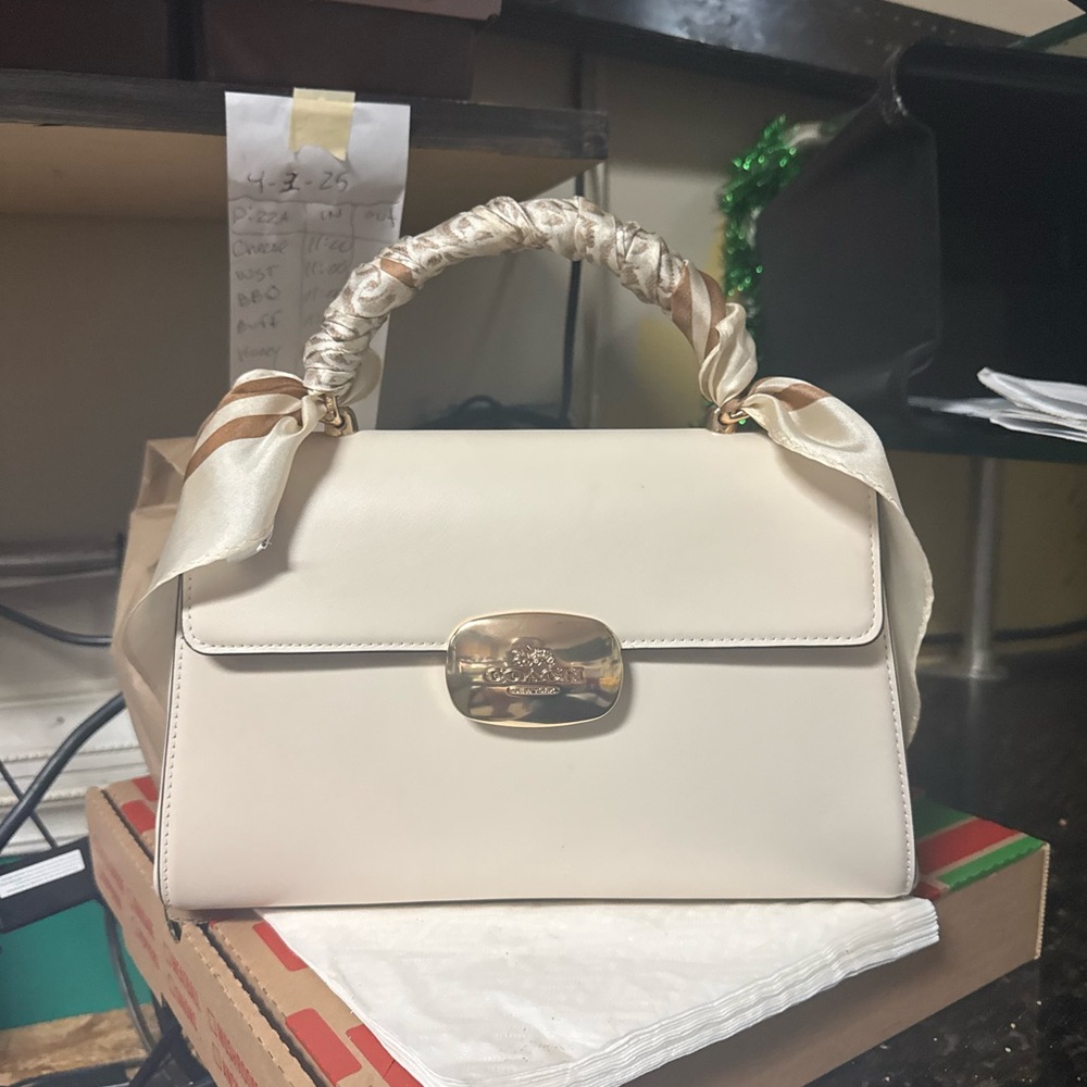 Elegant Cream Handbag with Gold Accents